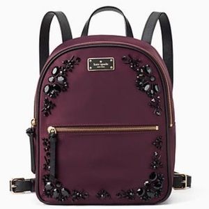 Dark purple Kate Spade backpack barely used.